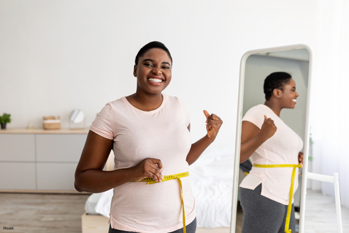 woman smiling after weight loss