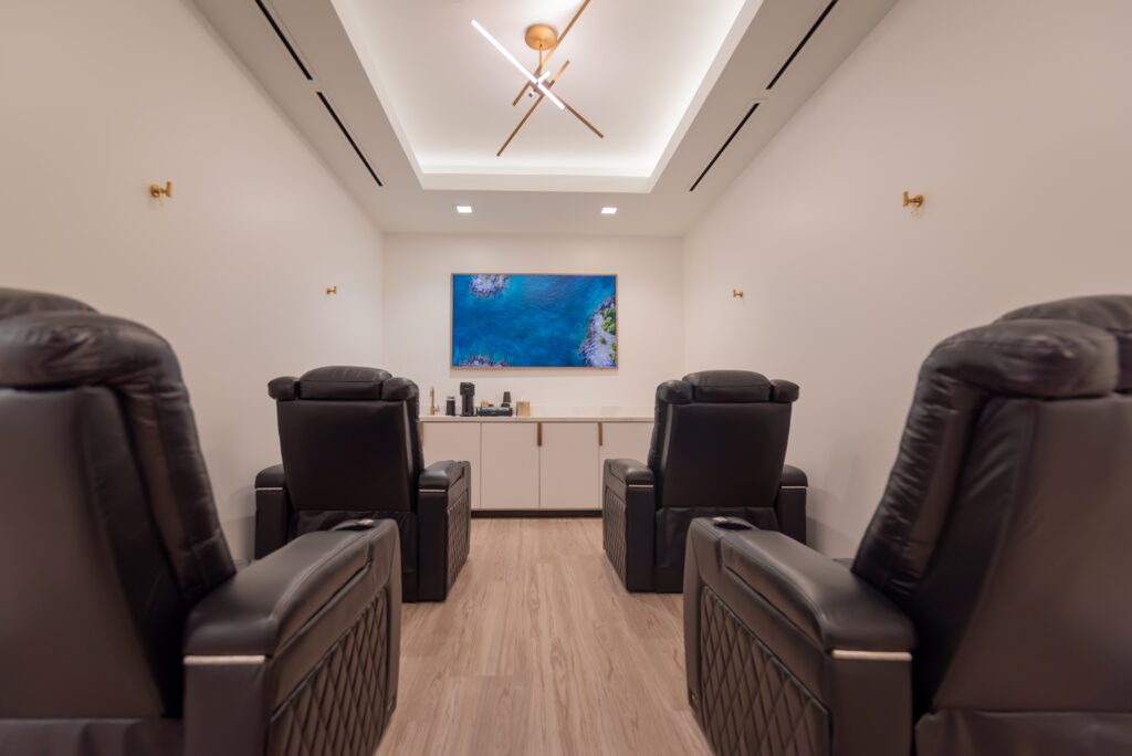 An inviting image of the luxurious IV Therapy Lounge at Sanjiva Medical Spa in Dallas, where guests can relax in plush recliners while receiving personalized IV therapy treatments for optimal wellness and vitality.